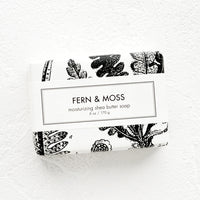 Fern & Moss: A bar of soap in black & white botanical graphic packaging.