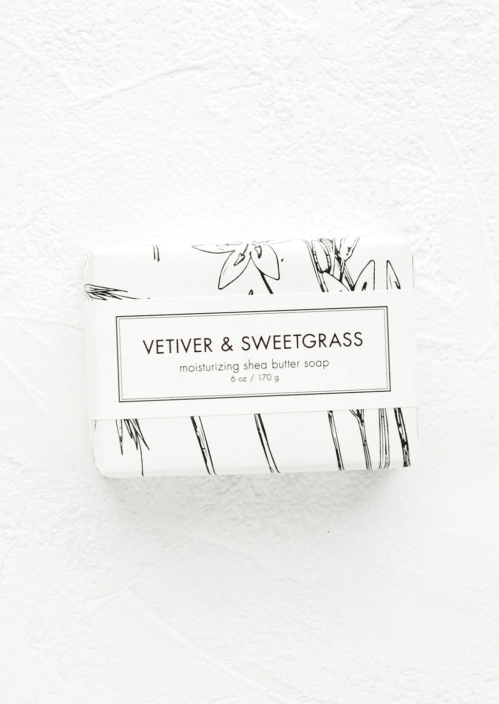Vetiver & Sweetgrass: A bar of soap in black & white botanical graphic packaging.