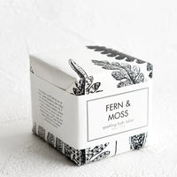 Fern & Moss: A cube-shaped bath fizzy box with black and white botanical graphic packaging.