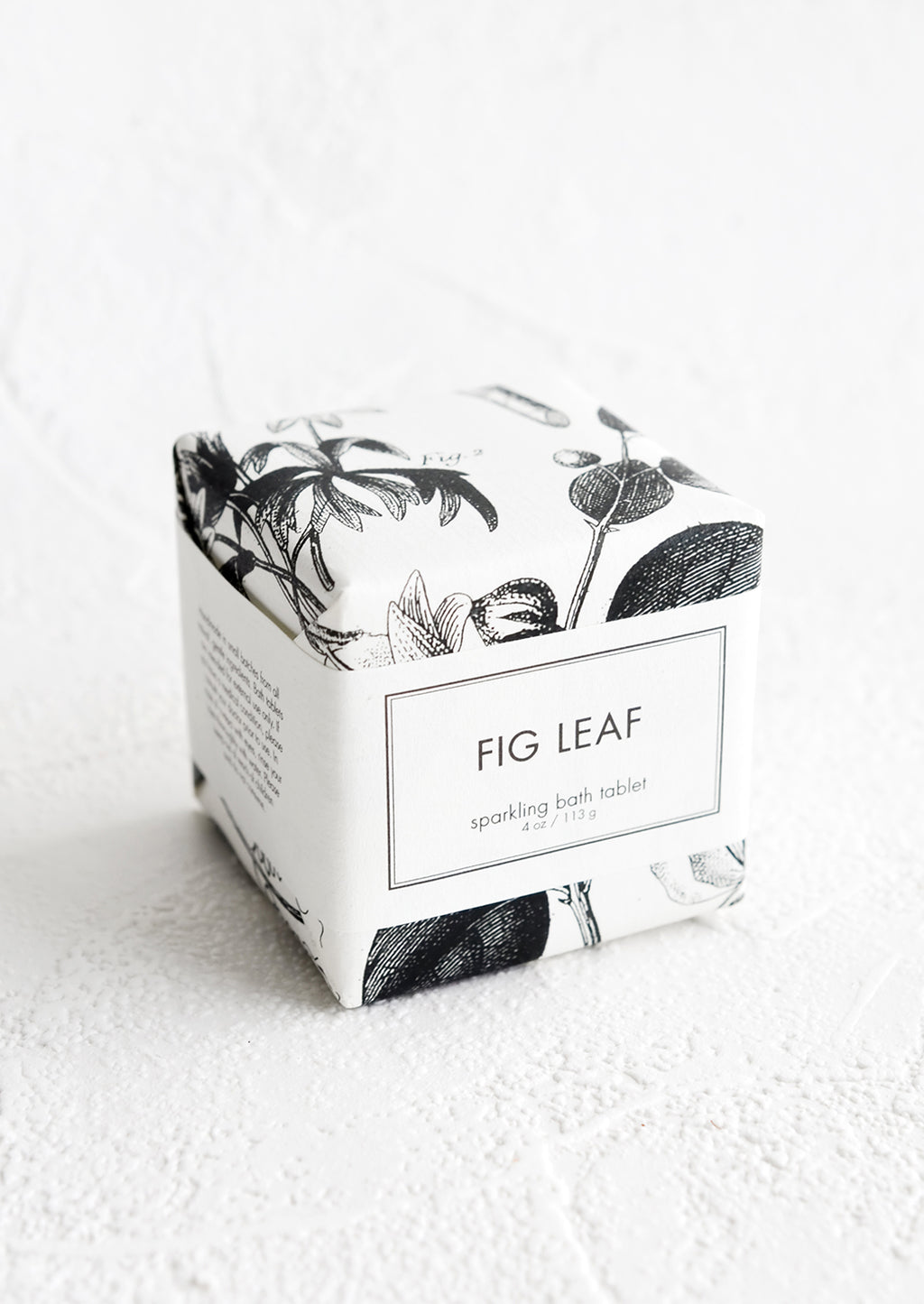 Fig Leaf: A cube-shaped bath fizzy box with black and white botanical graphic packaging.