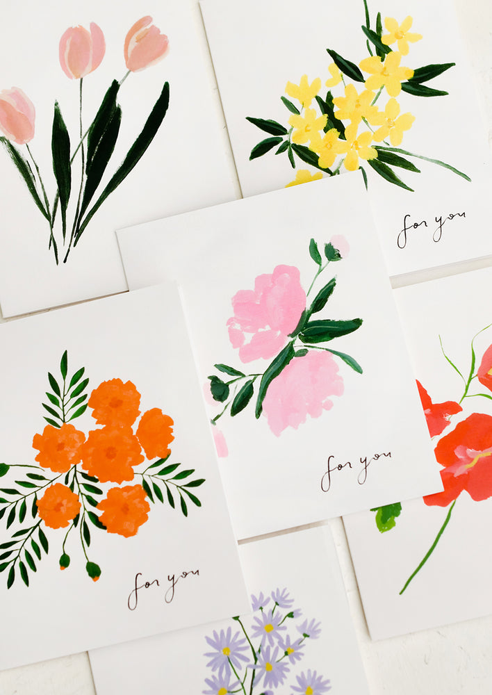 A set of white greeting cards in assorted floral prints with text at corner reading "for you".