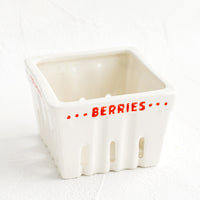 Berries: A white ceramic basket designed to look like a berry basket with "Berries" printed in red lettering.