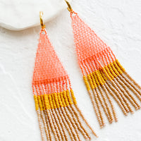 Cosmo Multi: Beaded earrings featuring pink, yellow and brown beads layered into fringe, dangling from a gold hoop.