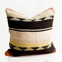 1: Square throw pillow in wool fabric with tan and black stripes, accents of orange and yellow.