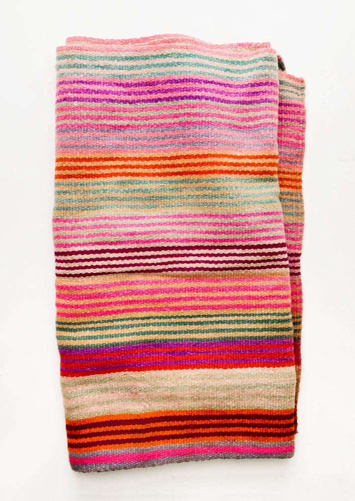 Vintage wool textile in thin, brightly multi-colored striped pattern