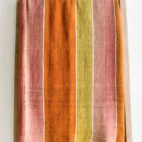 1: A vintage frazada textile in wide stripe pattern in orange, pink and yellow.