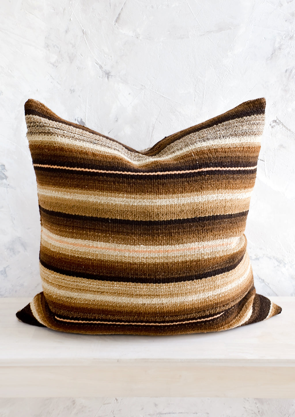 1: Throw pillow made from vintage wool fabric in brown, cream and peach stripes