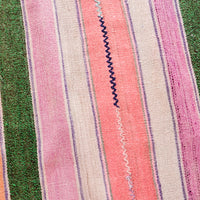 3: Wool textile in multicolor striped pattern with zigzag stitch detail at center
