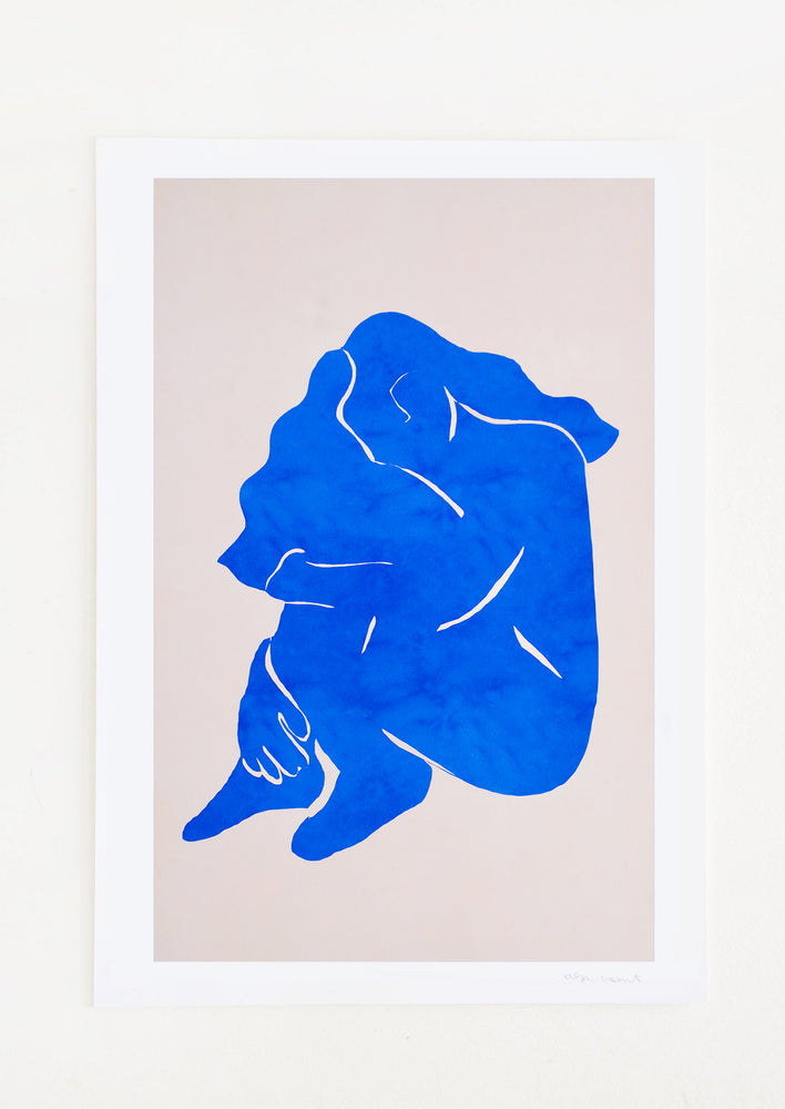 Digital art print featuring a bright blue silhouetted image of a woman in the fetal position.