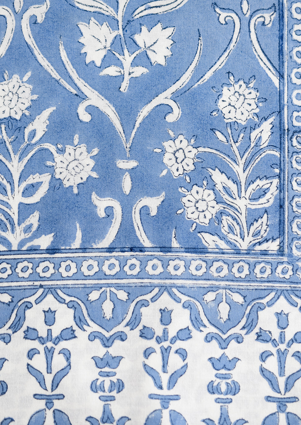 3: A floral print tablecloth in blue and white.