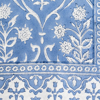 3: A floral print tablecloth in blue and white.