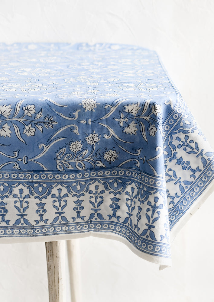 A floral print tablecloth in blue and white.