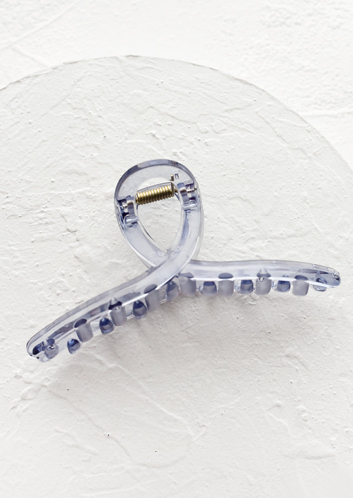 A french twist acrylic hair clip in blue.