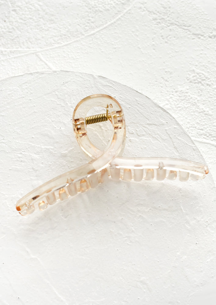 A french twist acrylic hair clip in pale honey.