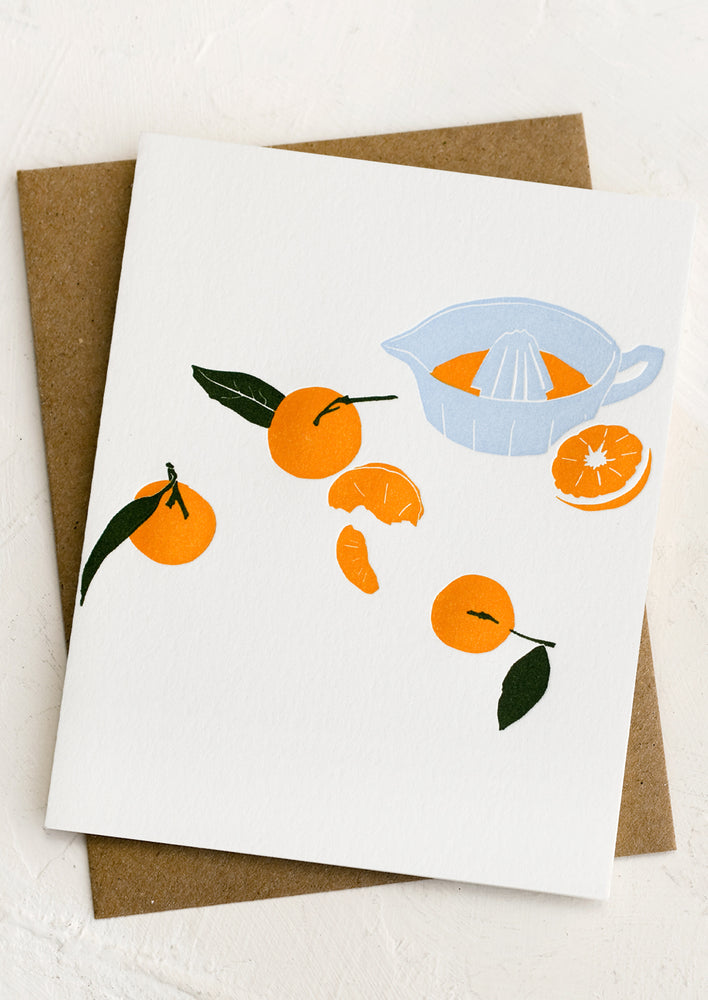 1: A letterpress greeting cards with image of oranges and juicer.