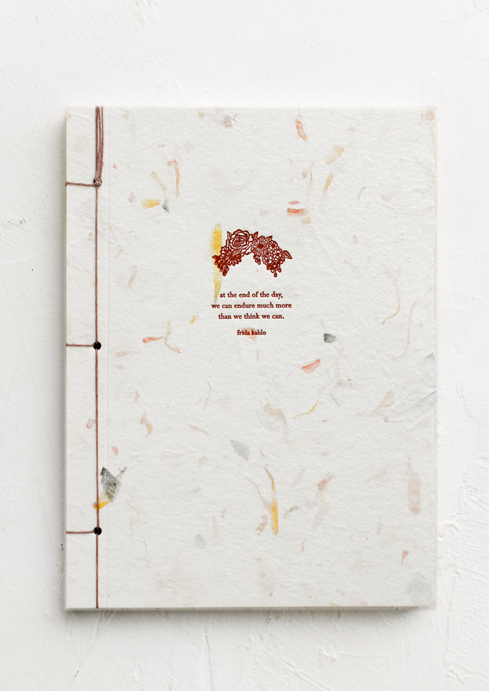 Frida Kahlo: A journal with flower paper cover with Frida Khalo quote.