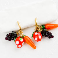 2: Gold hoop earrings with glass fruit and veggie charms.