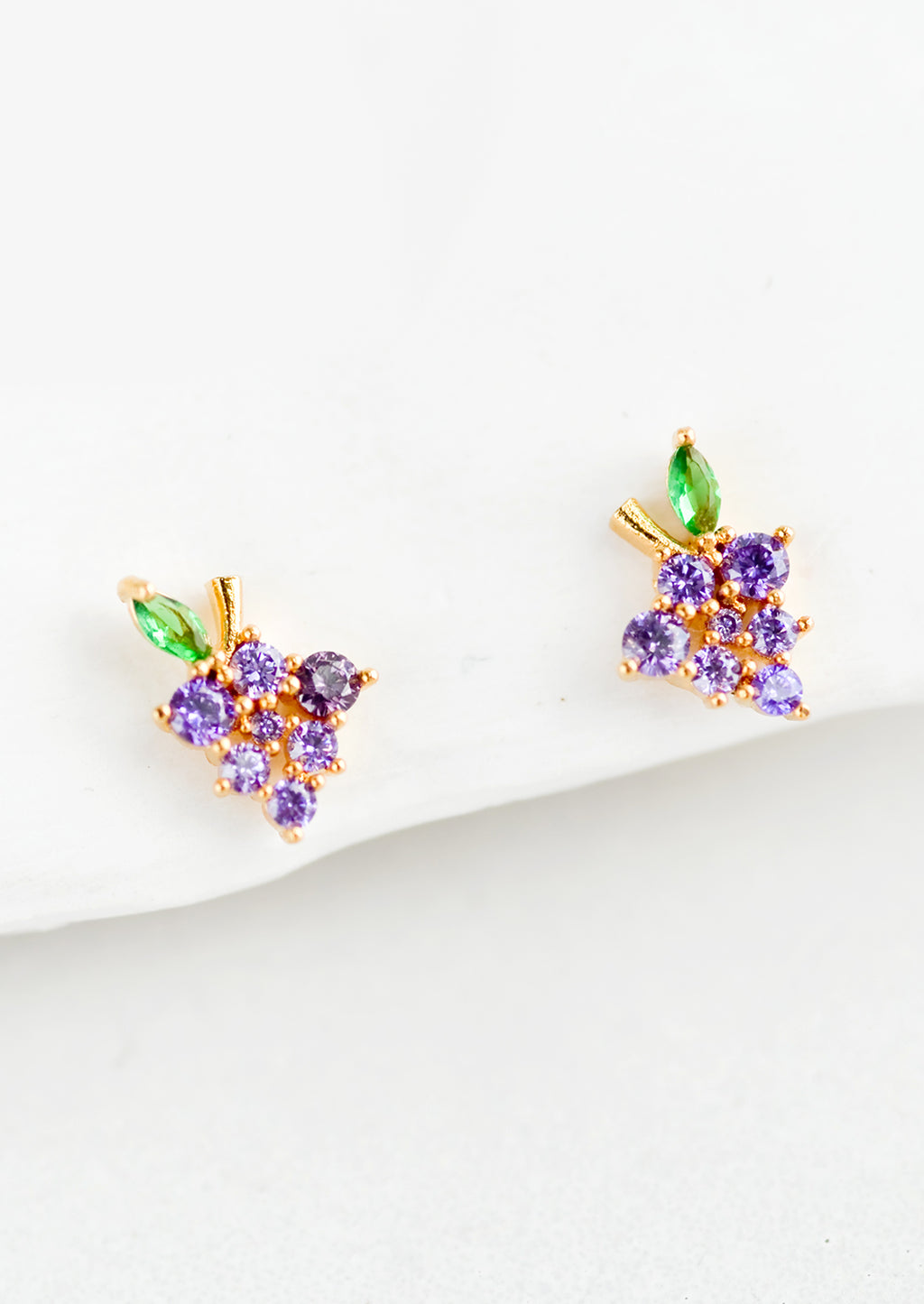 Grape: A pair of small crystal stud earrings in the shape of a bundle of grapes.