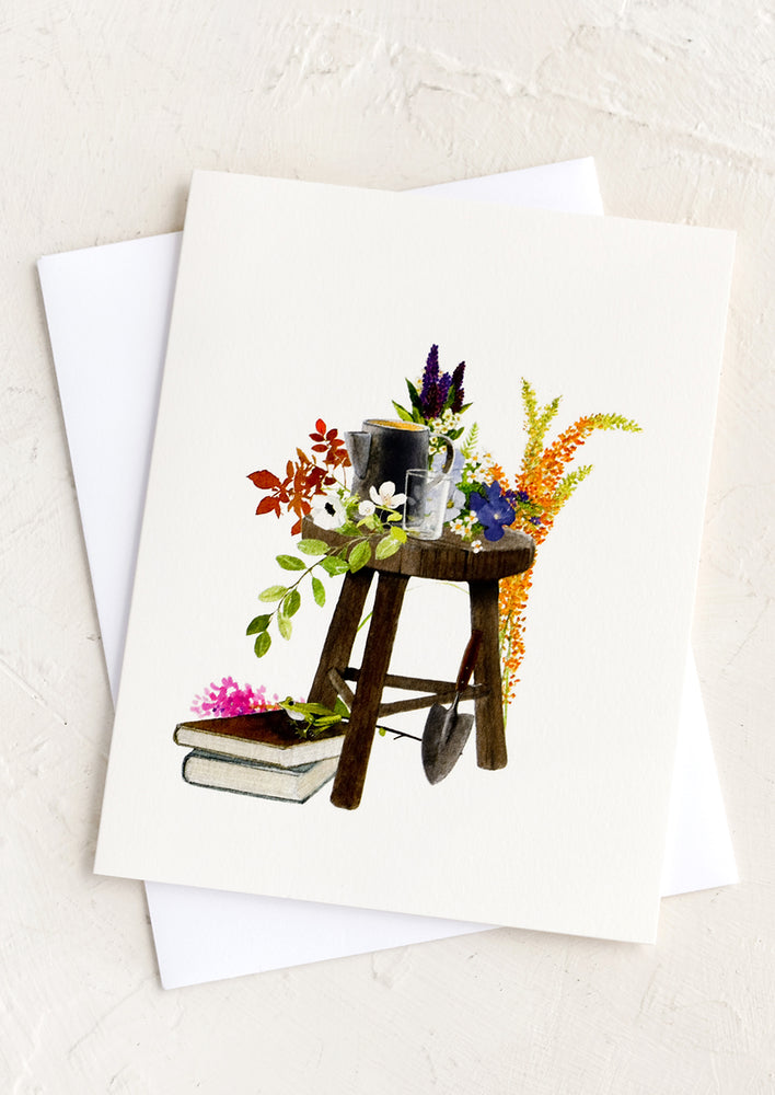 1: A greeting card with illustration of gardener's stool.