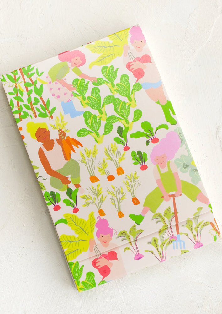 2: A notebook with gardener print cover.