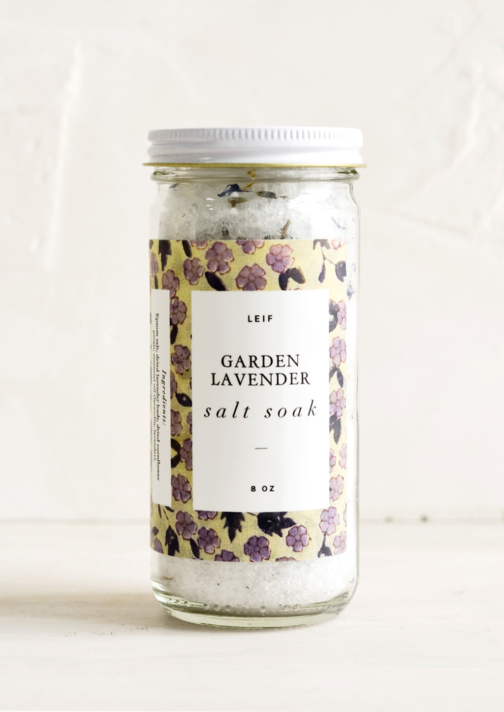Garden Lavender: A straight sided glass jar containing Garden Lavender salt soak.