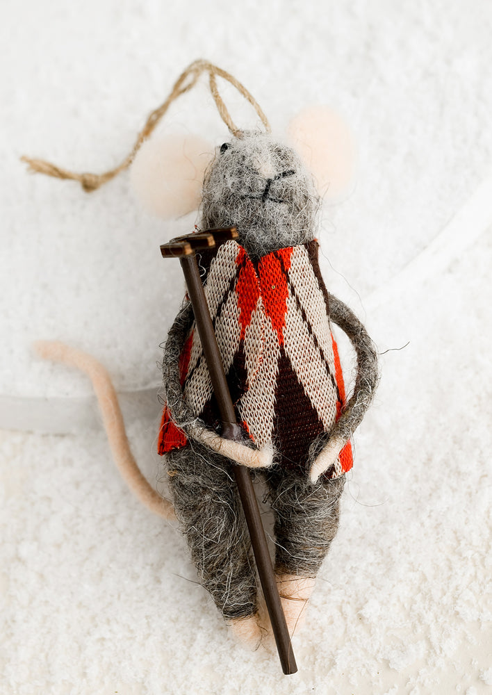 Rake: A felted mouse ornament wearing an argyle sweater and holding a rake.