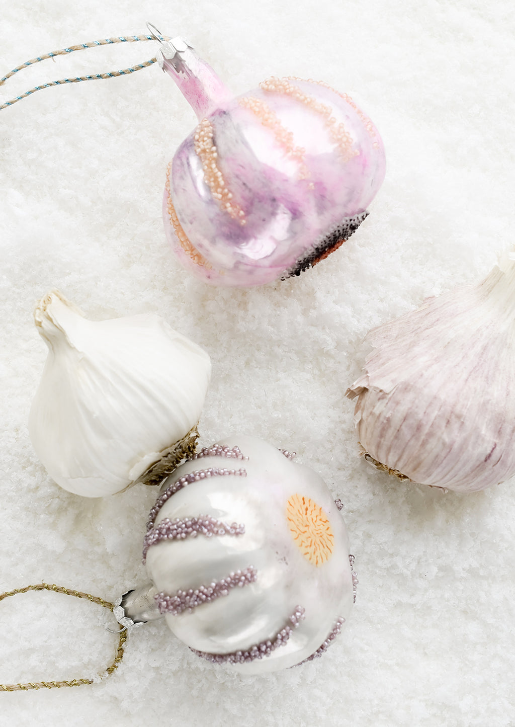 2: Garlic ornaments next to real garlic.