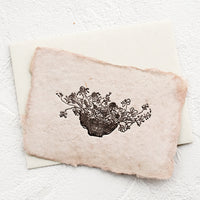 2: A greeting card made from handmade paper with a letterpress printed image of flowers in a bowl.