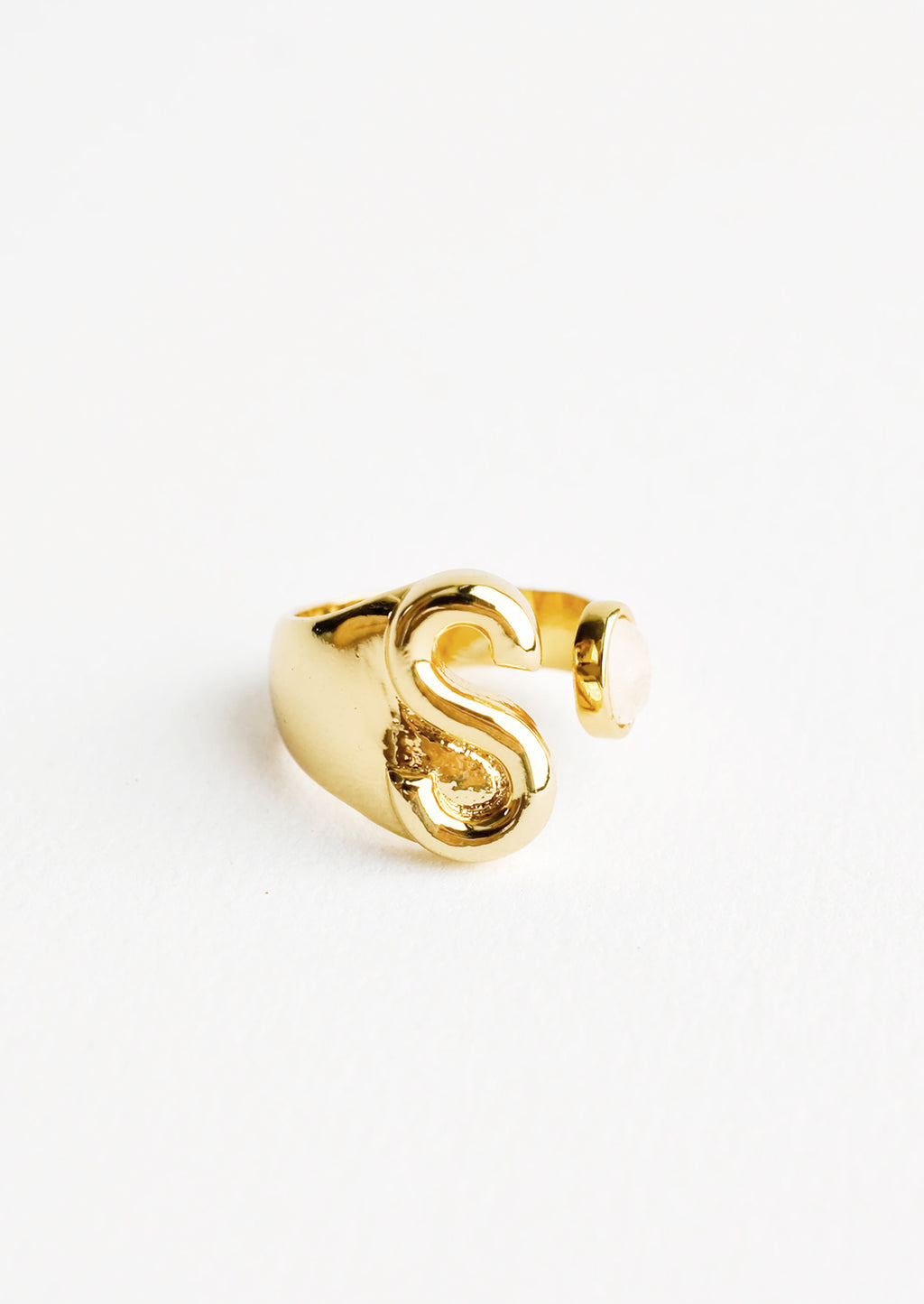 S: Yellow gold ring with letter S and oval glass crystal, and wide adjustable band.