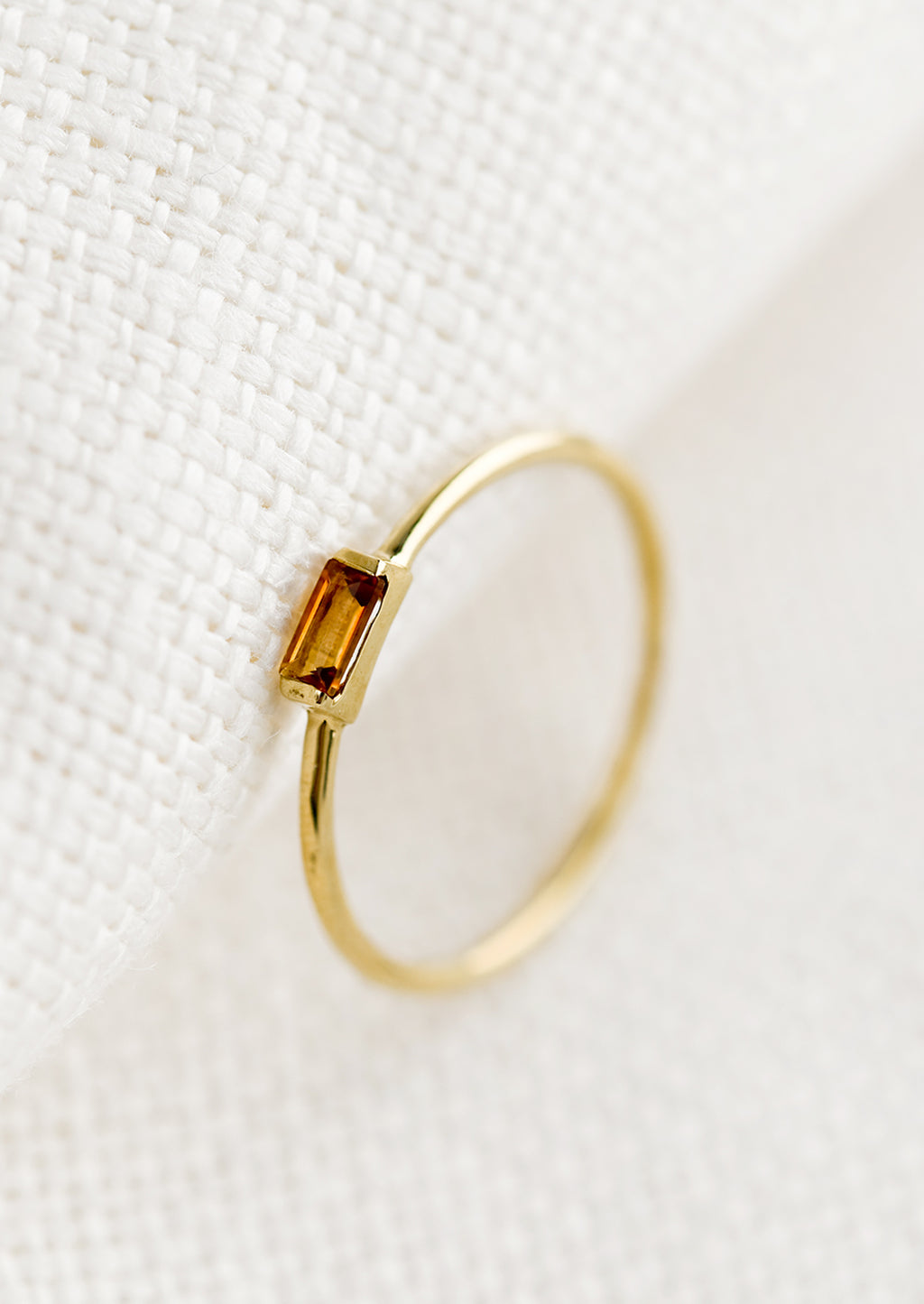 Citrine / Size 5: A gold ring with slim baguette stone in citrine.