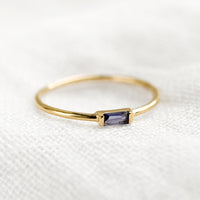 Iolite / Size 5: A gold ring with slim baguette stone in iolite.