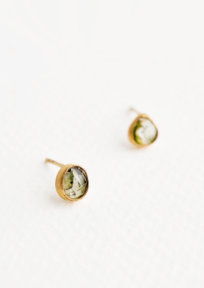Greens: Brass asymmetric stud earrings featuring a green multicolored tourmaline stone.