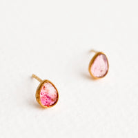 Pinks: Brass asymmetric stud earrings featuring a pink multicolored tourmaline stone.