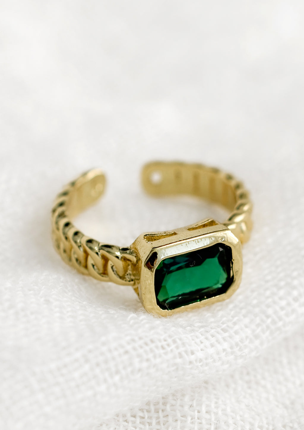 One Size / Emerald: A gemstone ring with heavy chainlink band and rectangular emerald baguette.