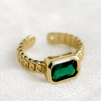 One Size / Emerald: A gemstone ring with heavy chainlink band and rectangular emerald baguette.