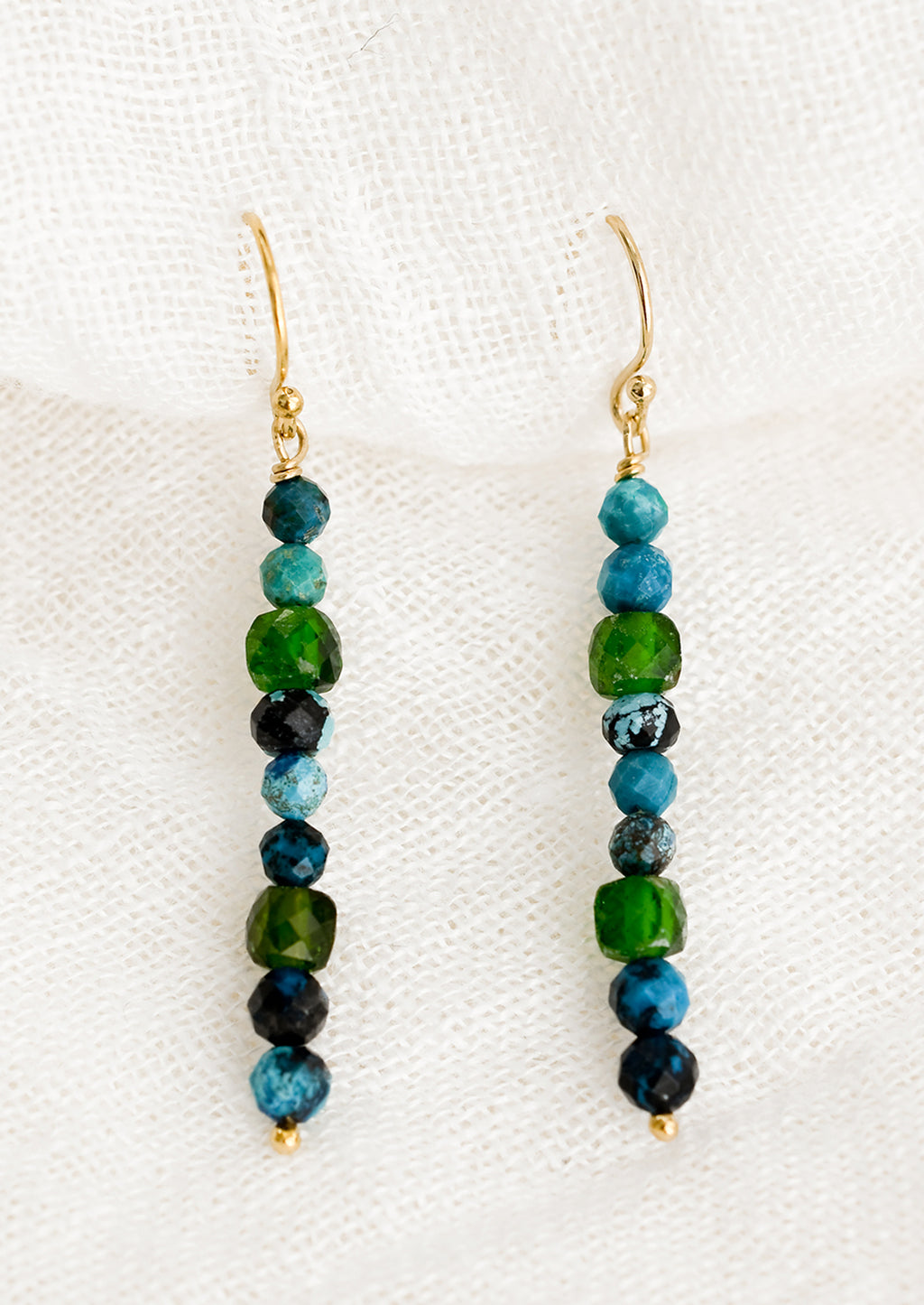 Turquoise Multi: A pair of turquoise and green beaded mixed gemstone earrings in a straight line.