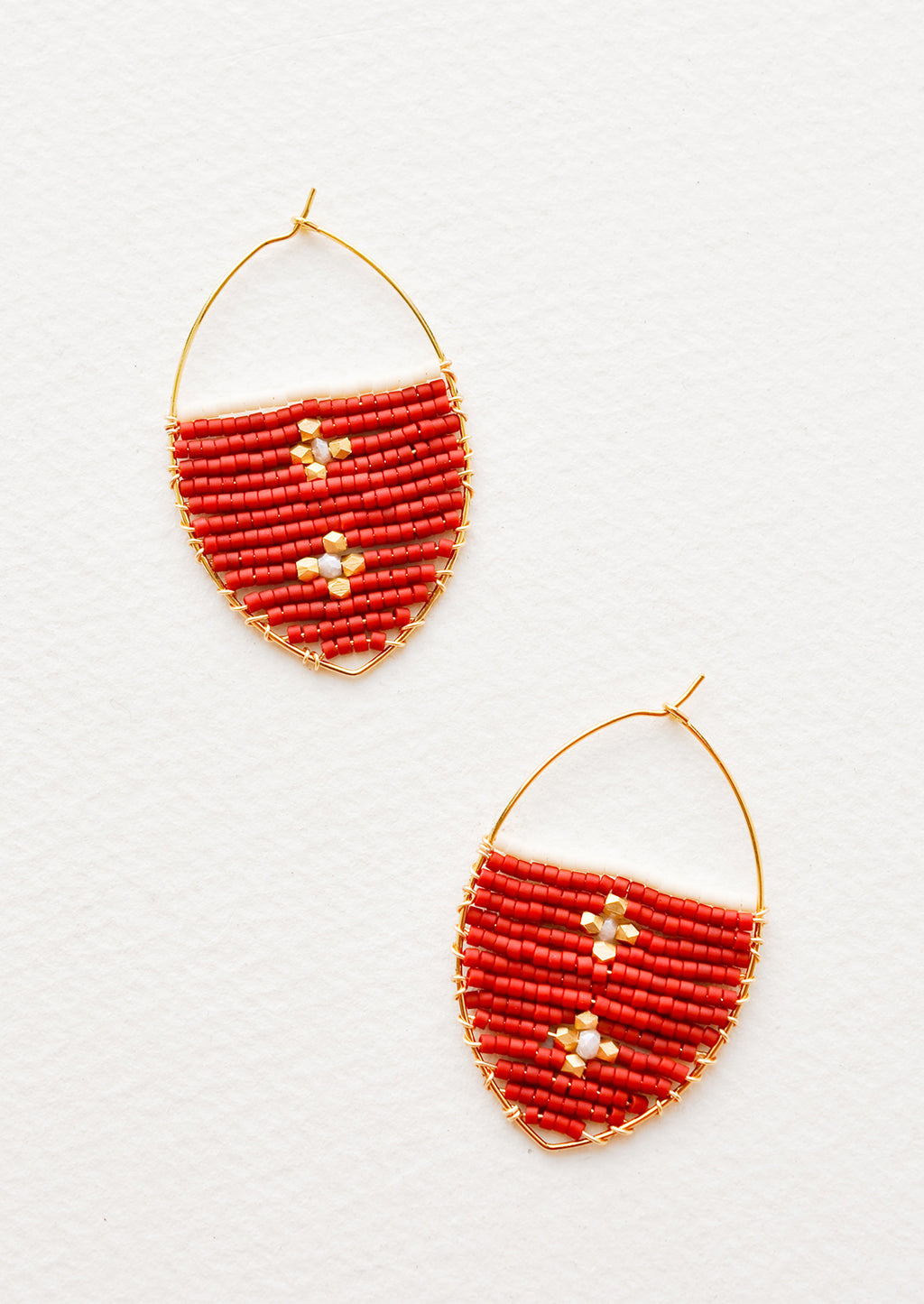 Crimson: Delicate gold drop earrings with a field of red glass beads featuring two gold equal-armed crosses.