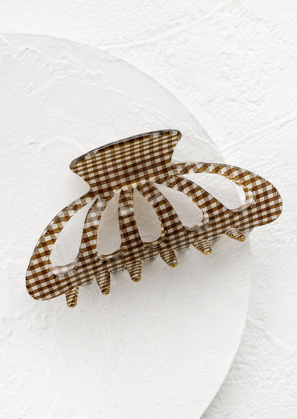 Cocoa: A gingham print hair claw in brown.