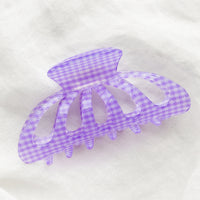 Lavender: A gingham print hair claw in lavender.
