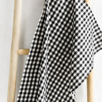 Black: A gingham print tea towel in black and white.
