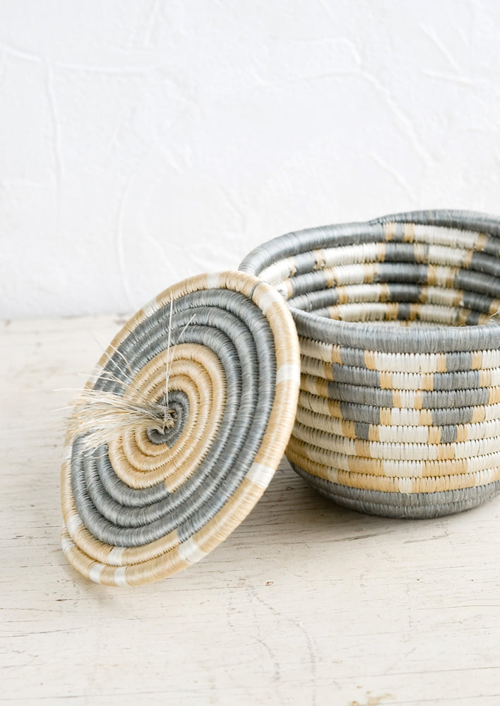 2: A small sweetgrass basket with matching lid askew.