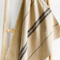 Sepia Stripe: A tea towel in light tan color with stripe print down the middle.