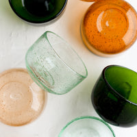1: Small tinted glass bowls in assorted colors.