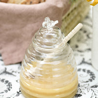 1: A glass honey jar in the shape of a beehive.