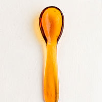 Honey: A glass spoon in honey color.