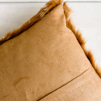 2: A brown faux suede pillow back with concealed zip.