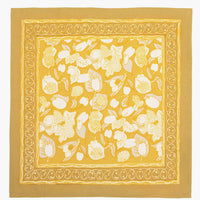 4: A pair of mustard/gold napkins with fruit print.