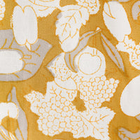 4: A gold, grey and white fruit print tea towel.