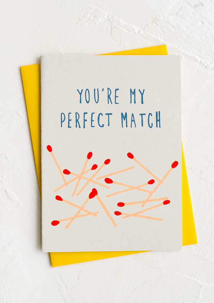 A greeting card with images of matchsticks and text reading "You're my perfect match".