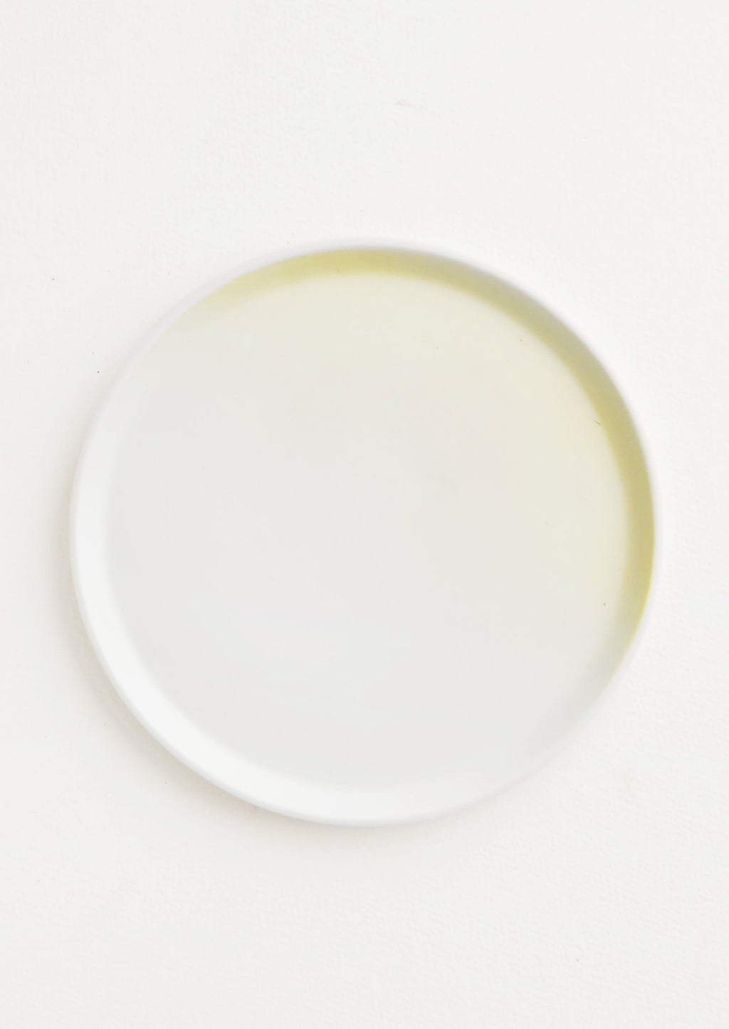 Daylight: A rimmed white and yellow ombre porcelain plate.